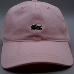 Pink Lacoste adjustable twill hat.